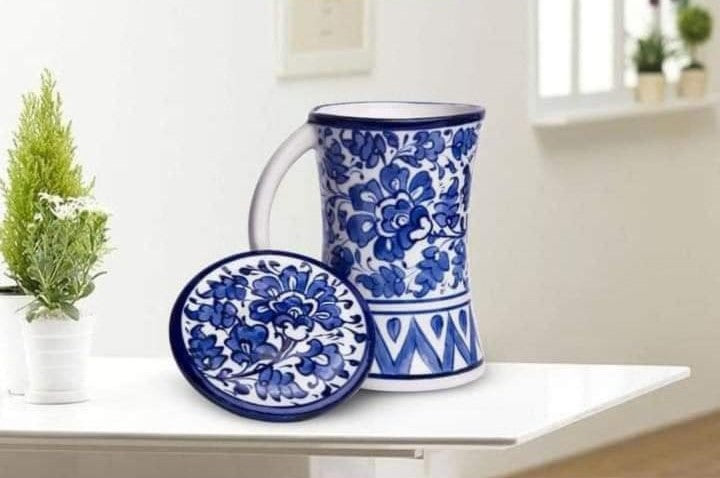 Handmade concave blue pottery mug with lid